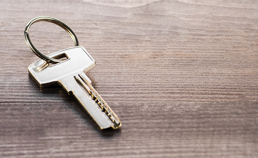 House key on wooden table