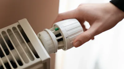 Close Up Hand Turning Up Heater (1)