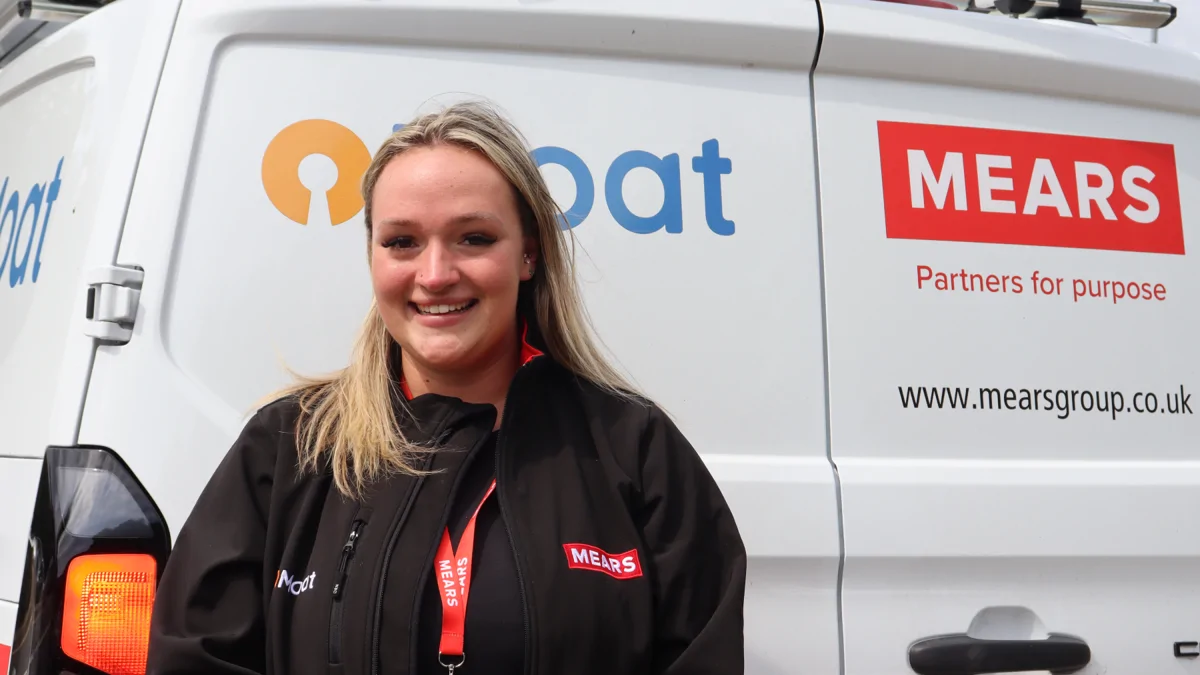 Image shows Katie from Mears standing on front of van