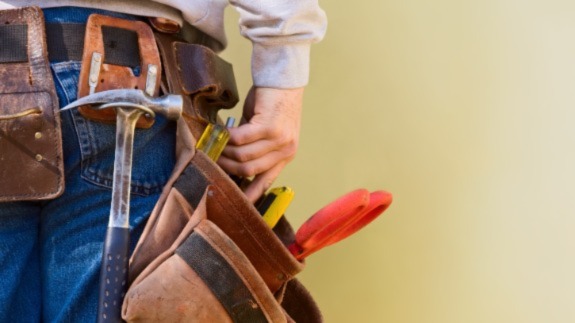 Handy person wearing tool belt