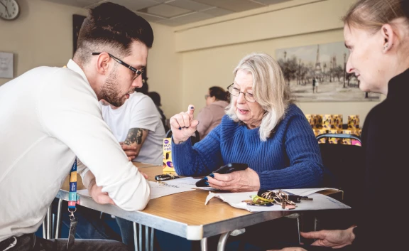 Customers and colleagues talk at Meet Moat Event