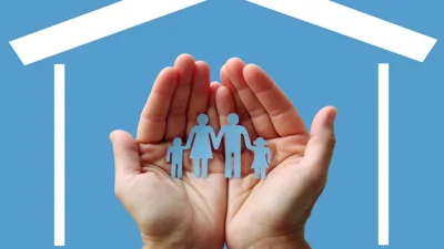 Graphic of a house with hands inside holding a family paperchain