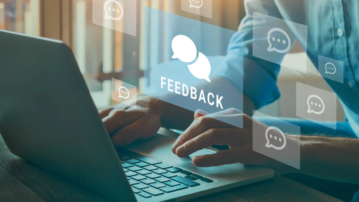 Person at laptop with feedback graphic