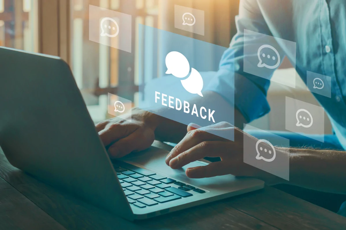 Person at laptop with feedback graphic