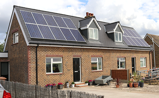 Home with pv solar panels on roof